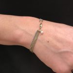 GSE Armband met 2 x goud en witte parel